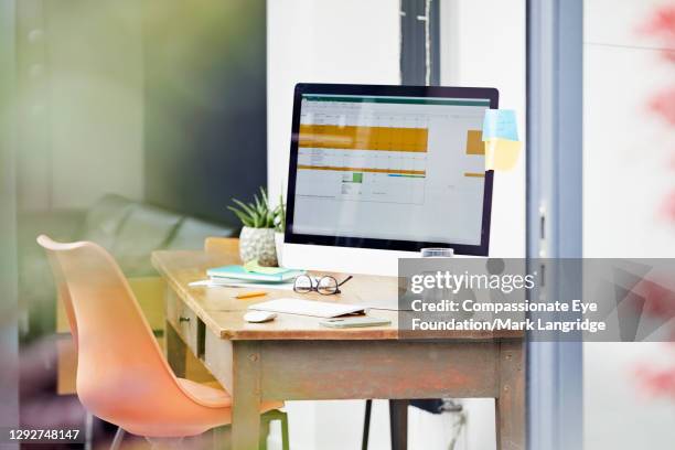 desk in home office - yellow sticky notes stock pictures, royalty-free photos & images