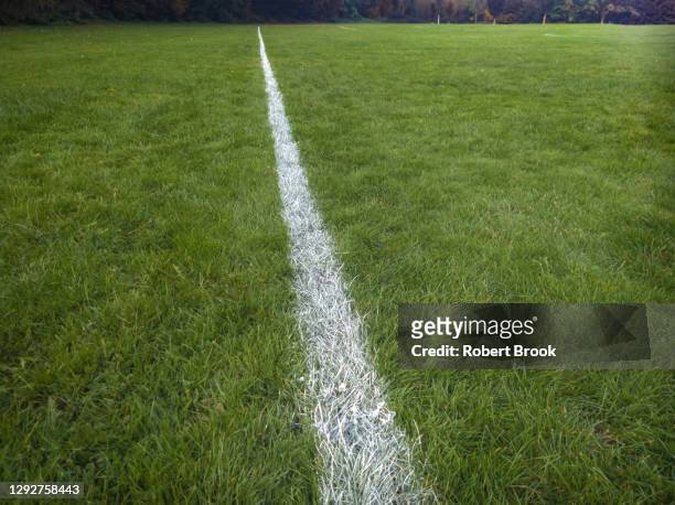 boundary line on community playing field. - local soccer field stock pictures, royalty-free photos & images