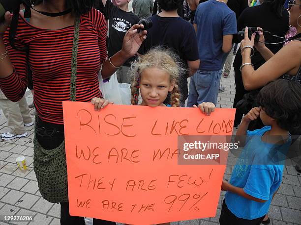 At least 1,000 people marched on October 15, 2011 from the Torch of Friendship in Biscayne Blvd - heart of Miami and close to Brickell Finanacial...