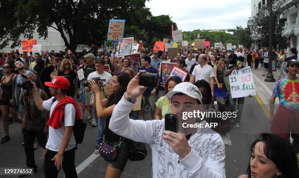 At least 1,000 people marched on October 15, 2011 from the Torch of Friendship in Biscayne Blvd - heart of Miami and close to Brickell Finanacial...