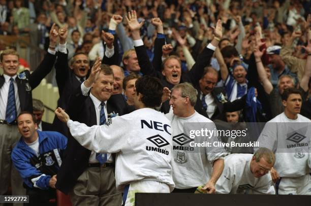 Joe Royle the Everton Manager congratulates Andres Limpar also of Everton after their FA Cup Final victory against Manchester United at Wembley...