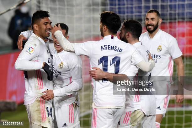 Casemiro of Real Madrid celebrates with Marco Asensio, Karim Benzema and team mates after scoring their sides first goal during the La Liga Santander...