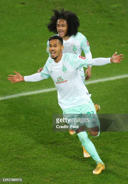 Theodor Gebre Selassie of SV Werder Bremen celebrates with team mate Tahith Chong after scoring their sides first goal during the DFB Cup second...