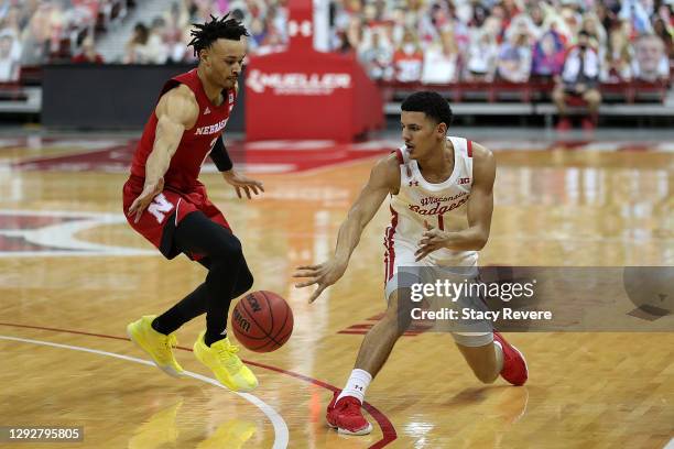 Jonathan Davis of the Wisconsin Badgers is defended by Trey McGowens of the Nebraska Cornhuskers during a game at Kohl Center on December 22, 2020 in...