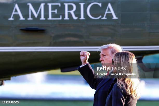 President Donald Trump and first lady Melania Trump walk on the south lawn of the White House on December 23, 2020 in Washington, DC. The Trumps are...