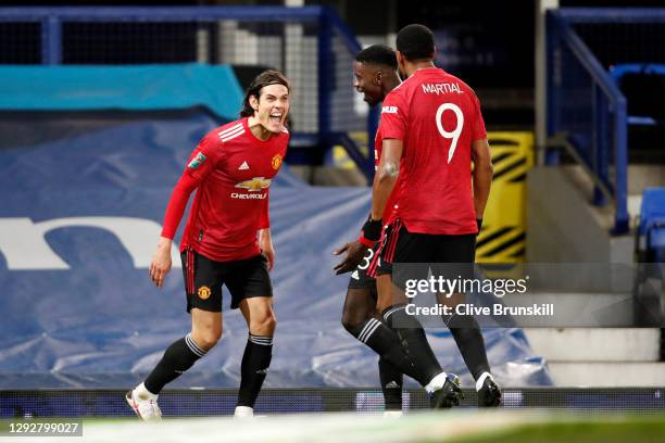 Edinson Cavani of Manchester United celebrates with team mates Axel Tuanzebe and Anthony Martial after scoring their sides first goal during the...