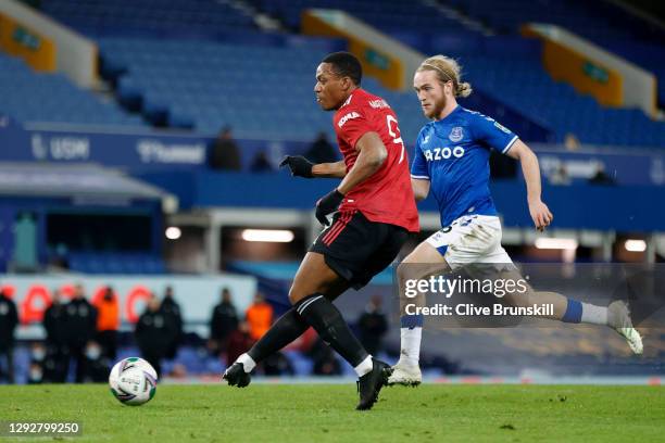 Anthony Martial of Manchester United scores their team's second goal under pressure from Tom Davies of Everton during the Carabao Cup Quarter Final...