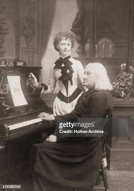 Hungarian composer Franz Liszt with American violinist Arma Senkrah , Weimar, Germany, July 1885. The portrait was taken by German photographer and...