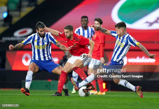 Sergio Oliveira of FC Porto and Otavio Edmilson da Silva of FC Porto competes for the ball with Adel Taararbt of SL Benfica during the Portuguese...