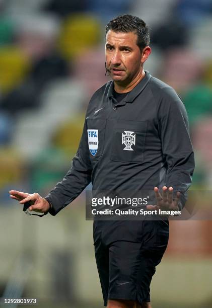 Referee Hugo Miguel gestures during the Portuguese Super Cup match between FC Porto and SL Benfica at Estadio Municipal de Aveiro on December 23,...