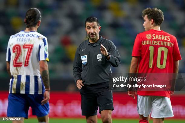 Referee Hugo Miguel gestures during the Portuguese Super Cup match between FC Porto and SL Benfica at Estadio Municipal de Aveiro on December 23,...