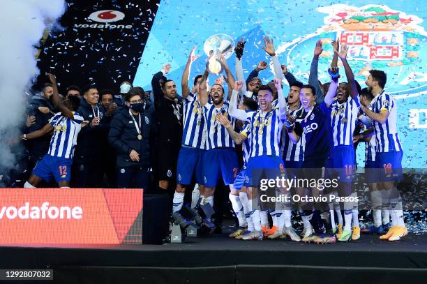 Sergio Oliveira of FC Porto lifts the Candido de Oliveira trophy with teammates following victory in the Portuguese Super Cup final between FC Porto...