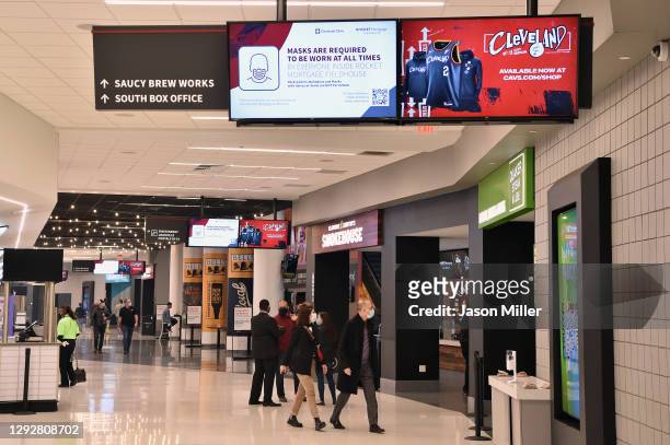 Warnings are seen at Rocket Mortgage Fieldhouse prior to the game between the Cleveland Cavaliers and the Charlotte Hornets on December 23, 2020 in...