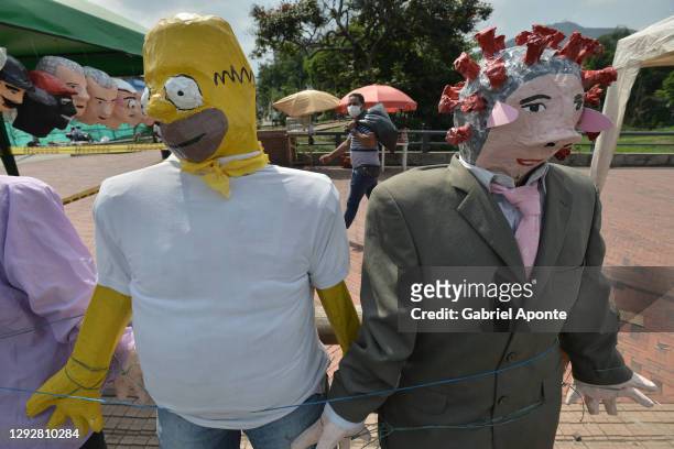 Bart Simpson doll is displayed for sale by street artisans on December 23, 2020 in Cali, Colombia. Every year, Colombians make dolls that symbolize...