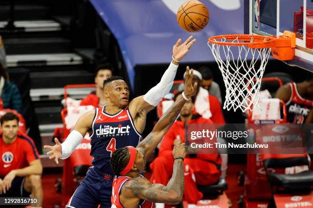 Russell Westbrook of the Washington Wizards elevates for a lay up over Dwight Howard of the Philadelphia 76ers during the first quarter at Wells...