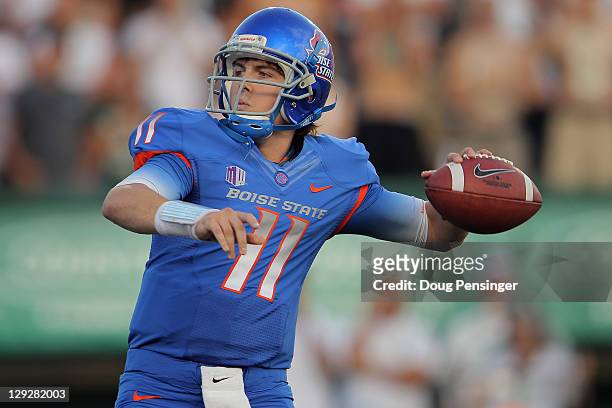 Quarterback Kellen Moore of the Boise State Broncos delivers a pass against the Colorado State Rams at Sonny Lubick Field at Hughes Stadium on...