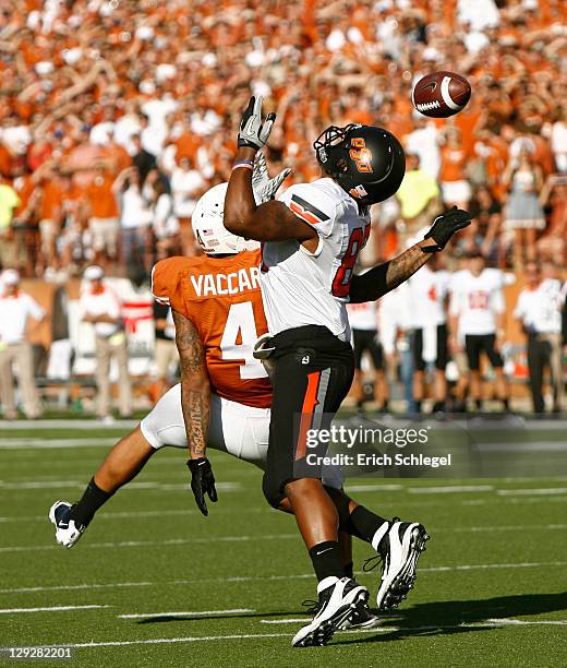 Safety Kenny Vaccaro of the Texas Longhorns breaks up a pass in the third quarter intended for wide receiver Tracy Moore of the Oklahoma State...