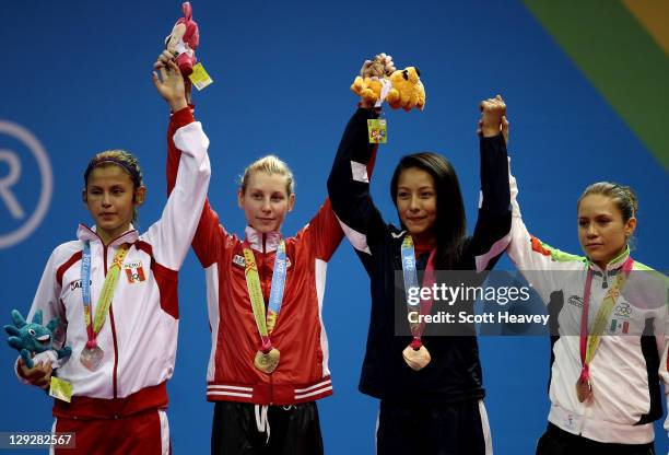 Lizbeth Diez Canseco of Peru , Ivett Gonda of Canada , Deireanne Estephany Morales of USA and Jannet Alegria of Mexico after the Women's Taekwondo...