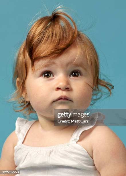 baby girl making face - funny baby face stock pictures, royalty-free photos & images