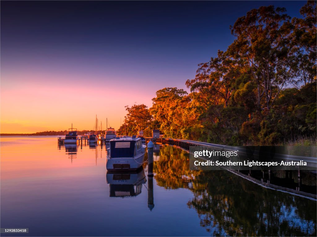 A beautiful, serene and very colourful summer dawn at Chinaman's Creek, Metung, Gippsland Lakes, Victoria, Australia.