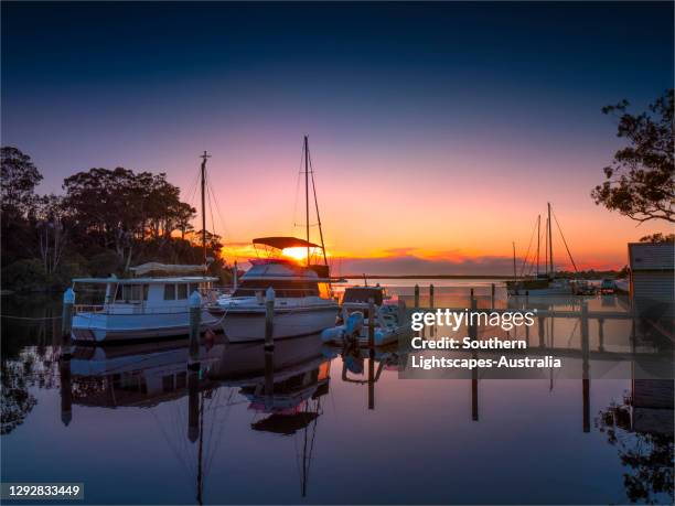 a beautiful, serene and very colourful summer dawn at chinaman's creek, metung, gippsland lakes, victoria, australia. - gippsland lakes stock pictures, royalty-free photos & images