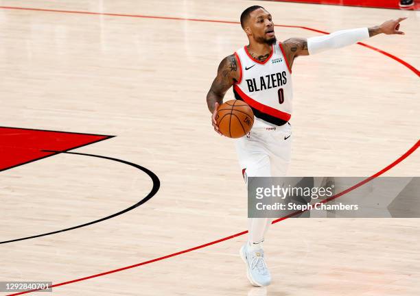 Damian Lillard of the Portland Trail Blazers dribbles against the Utah Jazz during the first half at Moda Center on December 23, 2020 in Portland,...