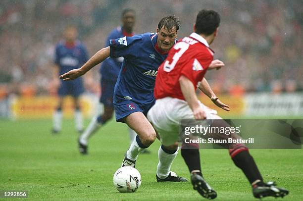 Denis Irwin of Manchester United tries to tackle Glenn Hoddle of Chelsea during the FA Cup Final at Wembley Stadium in London. Manchester United won...