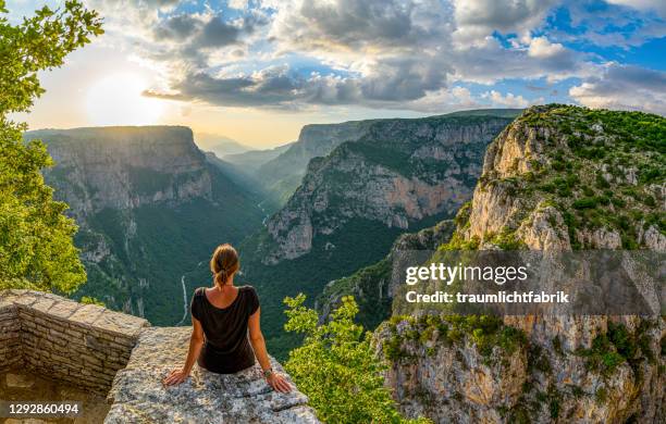 woman enjoying the view of vikos canyon in greece - epirus greece fotografías e imágenes de stock