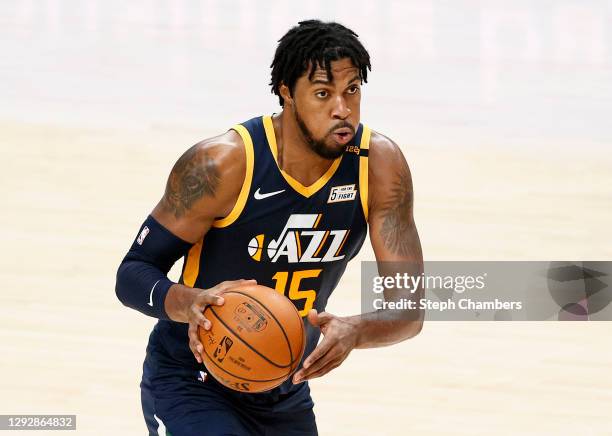 Derrick Favors of the Utah Jazz looks to pass against the Portland Trail Blazers during the second half of the game at Moda Center on December 23,...