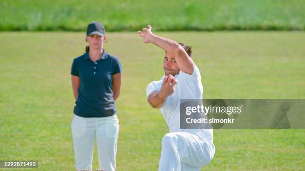bowler bowling cricket ball - cricket umpire stock pictures, royalty-free photos & images