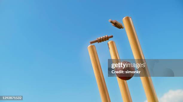cricket ball hitting the stumps - cricket ball hitting stumps stock pictures, royalty-free photos & images