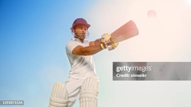batsman playing cricket - man with cricket bat stock pictures, royalty-free photos & images