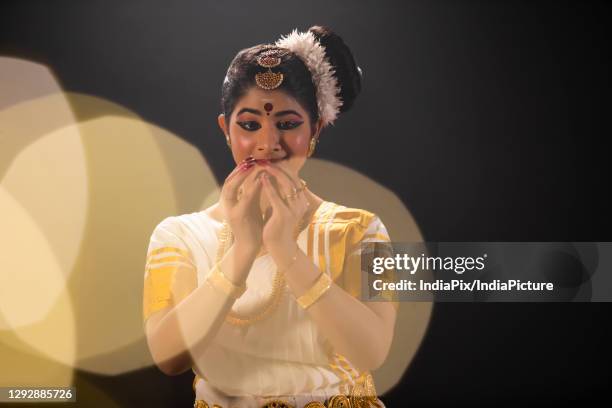 mohiniattam dancer depicting a budding flower through her dance performance - bangle stock pictures, royalty-free photos & images