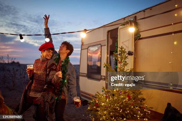 happy couple celebrate new year - alternative lifestyle stock pictures, royalty-free photos & images