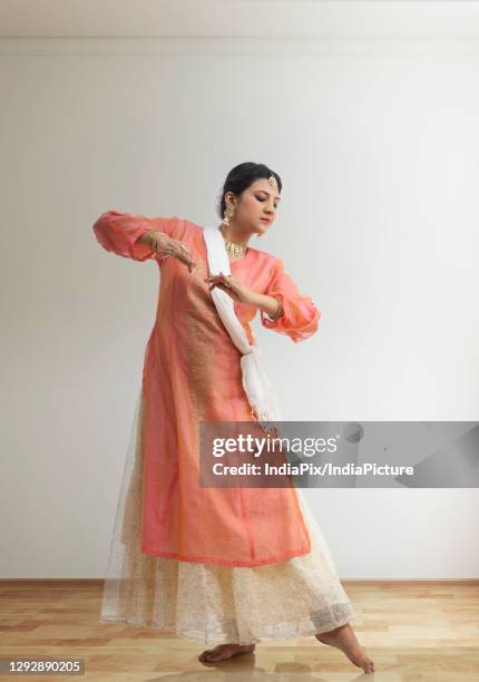 kathak dancer giving a mesmerising performance at home. - traditional ceremony stock pictures, royalty-free photos & images