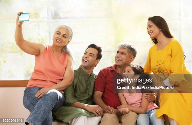 joint family taking a selfie - father clicking selfie bildbanksfoton och bilder