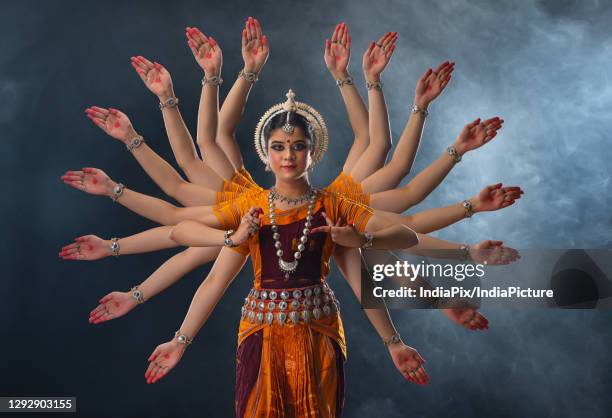 odissi dancer performing surya dev mudra - odisha dance stock pictures, royalty-free photos & images