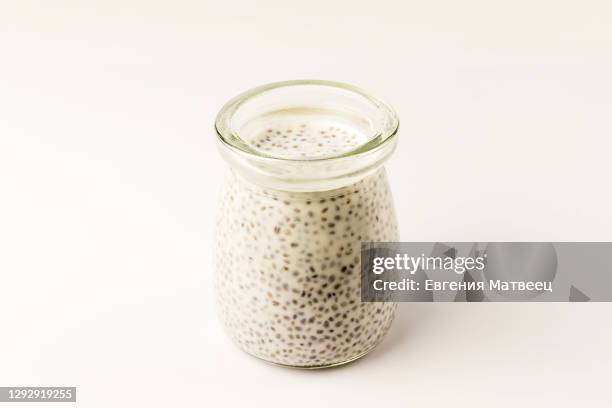 chia seed milk pudding small glass yogurt jar. close up. selective focus - pudding stock pictures, royalty-free photos & images