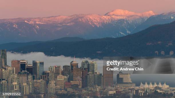 View of downtown Vancouver skyline at sunrise on December 24, 2020 in Burnaby, British Columbia, Canada. The Provincial Health Officer has ordered...