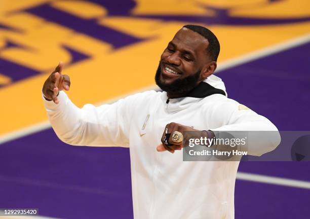 LeBron James of the Los Angeles Lakers poses with his ring during the 2020 NBA championship ring ceremony before their opening night game against the...