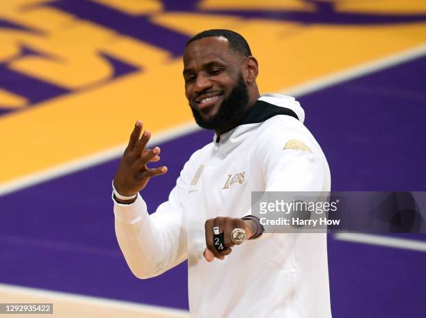LeBron James of the Los Angeles Lakers poses with his ring during the 2020 NBA championship ring ceremony before their opening night game against the...