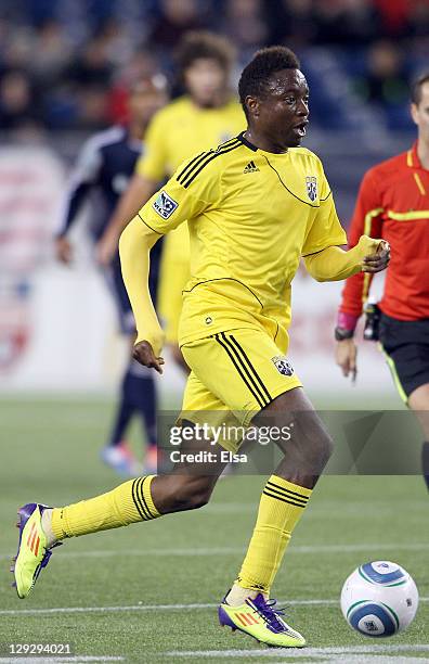Emmanuel Ekpo of the Columbus Crew takes the ball against the New England Revolution on October 15, 2011 at Gillette Stadium in Foxboro,...