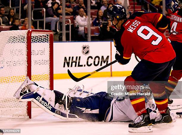 Goalie Mathieu Garon of the Tampa Bay Lightning stops a shot by the Florida Panthers' Stephen Weiss in the second period at BankAtlantic Center in...