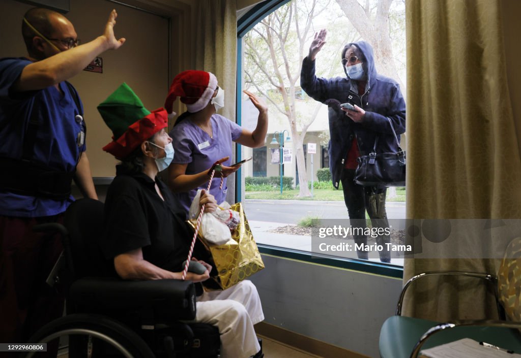 Family Members Visit Relatives At California Nursing Facility On Christmas Eve