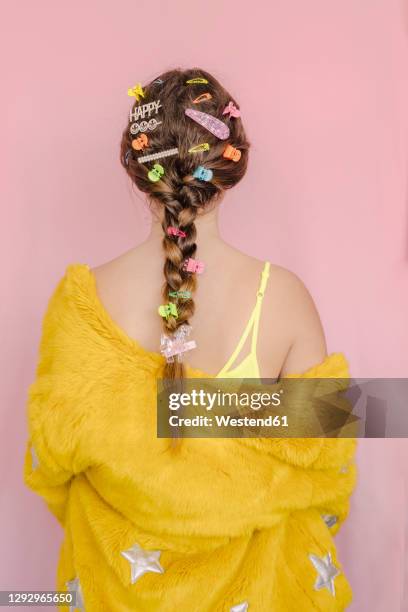 teenage girl with various hair pins in her braid, rear view - hair clip stock pictures, royalty-free photos & images