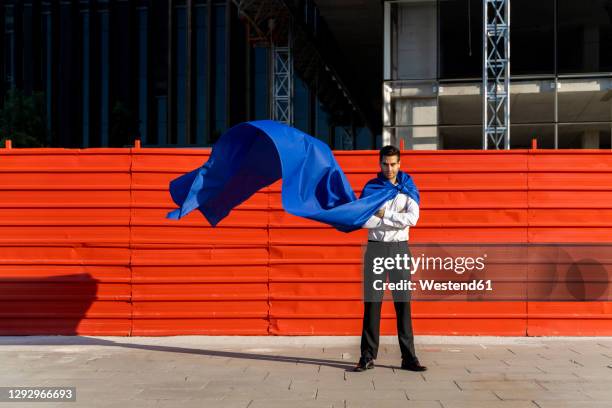 confident businessman wearing superhero cape in the city - cape garment ストックフォトと画像