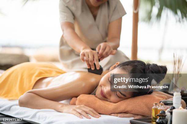 feeling relaxed as the heat hits my body - thai massage stock pictures, royalty-free photos & images