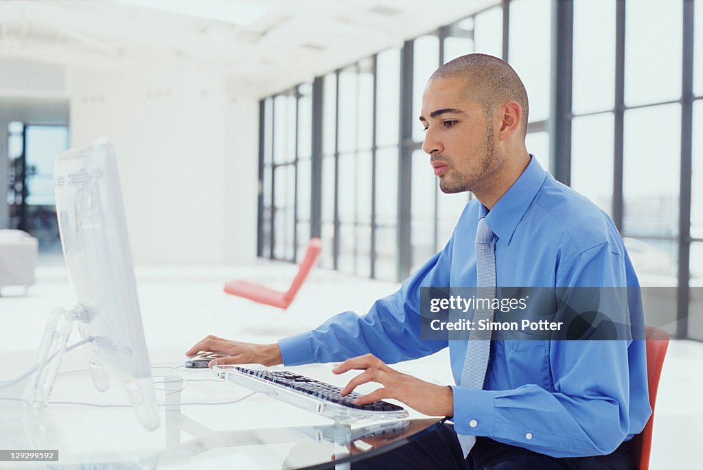 Businessman using computer in office