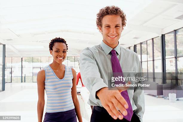 businessman extending hand in greeting - inviting gesture stockfoto's en -beelden
