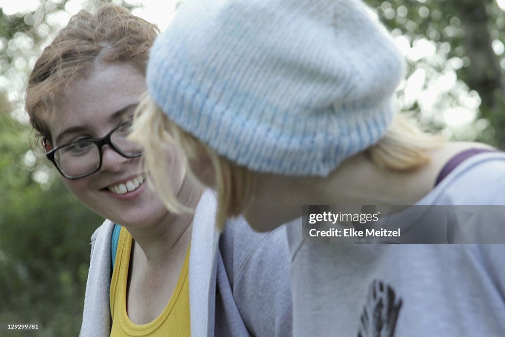 Girls smiling together in park